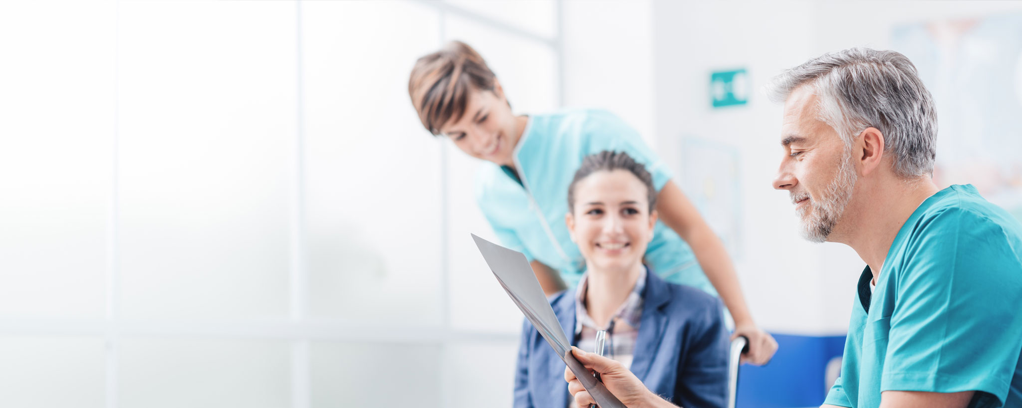 people reviewing a paper and smiling