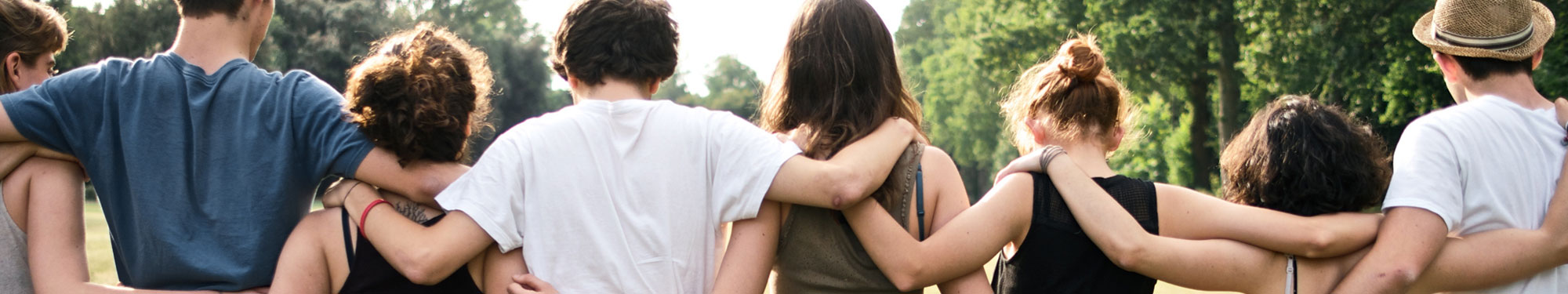 group of people with their arms around each other