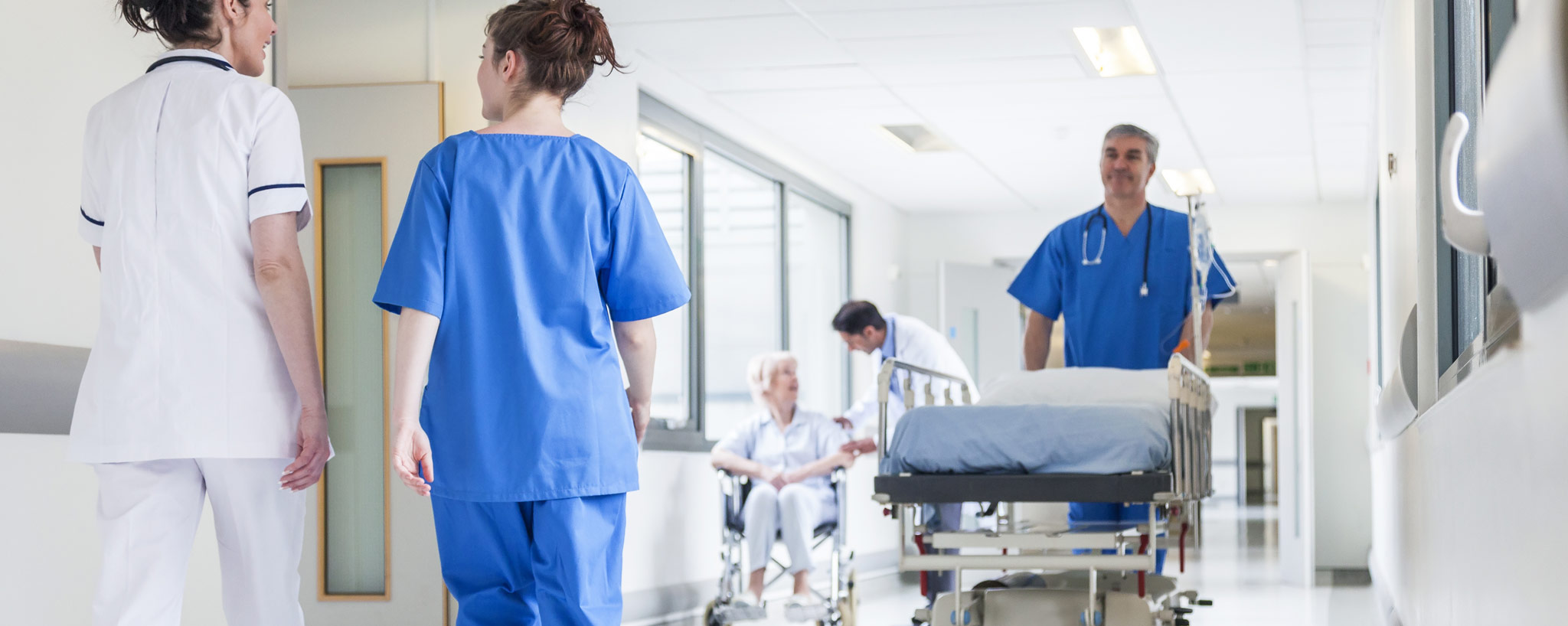 healthcare hallway with workers