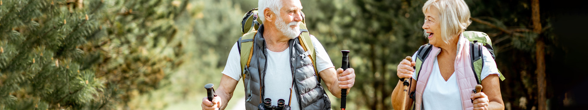 middle aged couple on a backpacking hike